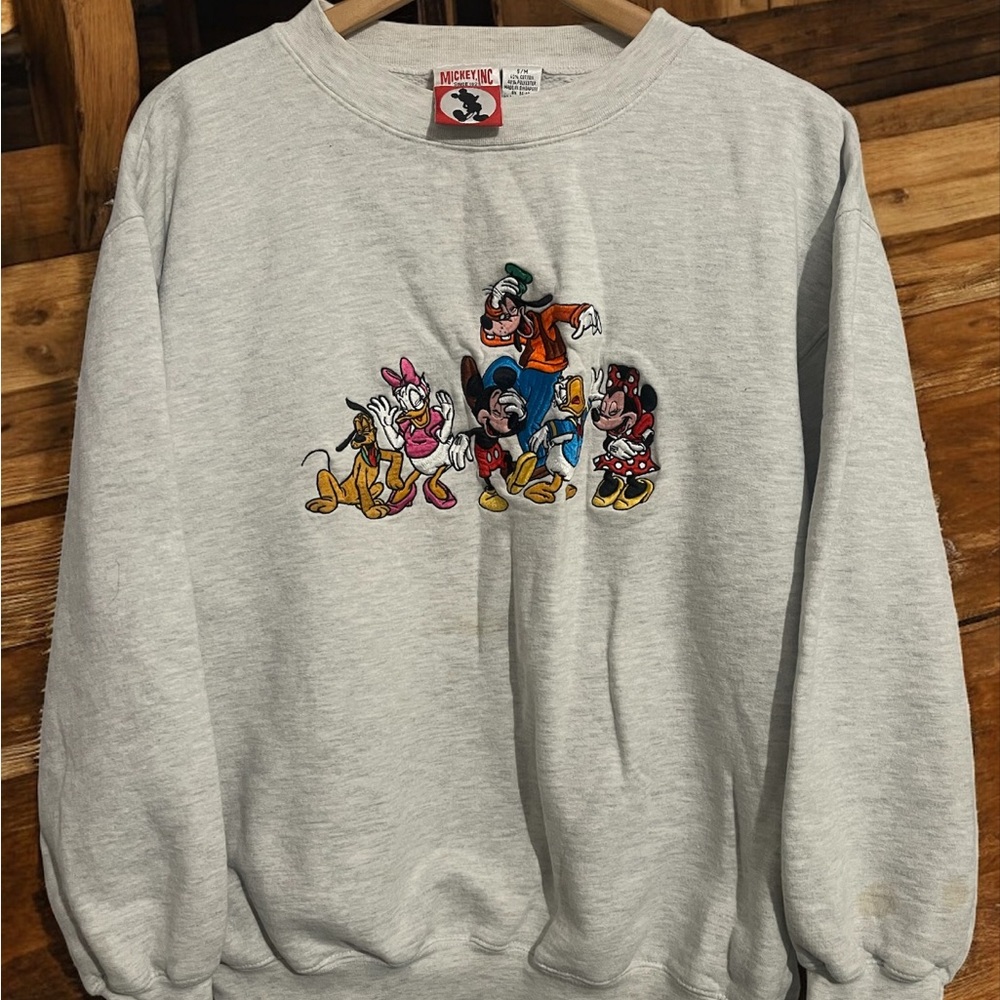 Disney Light Gray Crewneck Sweater with Character Design

If it has stains